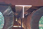 stainless screws attached to steel T beams