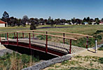 Orange Arched Steel Bridge Cruiserline Handrail
