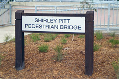 Timber signage to match the bollards and fencing