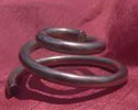 Volute washers accommodate shrinkage